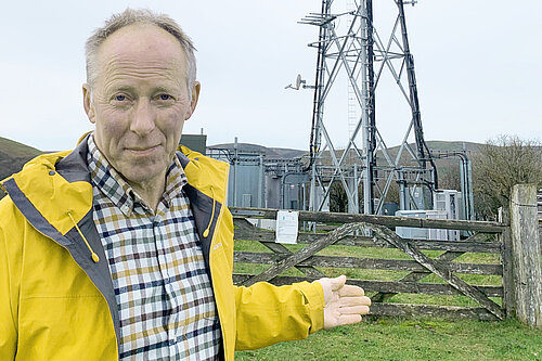 Chris Naylor with a mobile phone mast