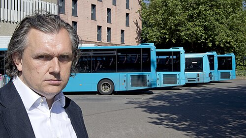 Councillor Rob Wilson with local buses